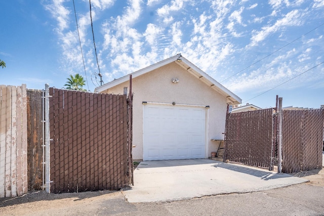 51 E Tuolumne St, Fresno, CA 93706 - garage with a gate and concrete driveway