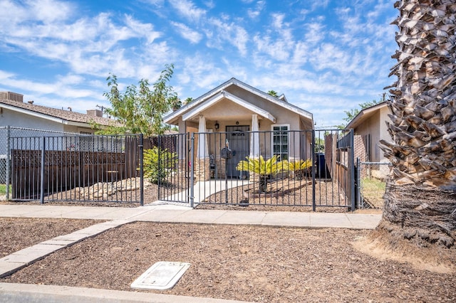 51 E Tuolumne St, Fresno, CA 93706 - view of front of home featuring a gate, a fenced front yard, and stucco siding