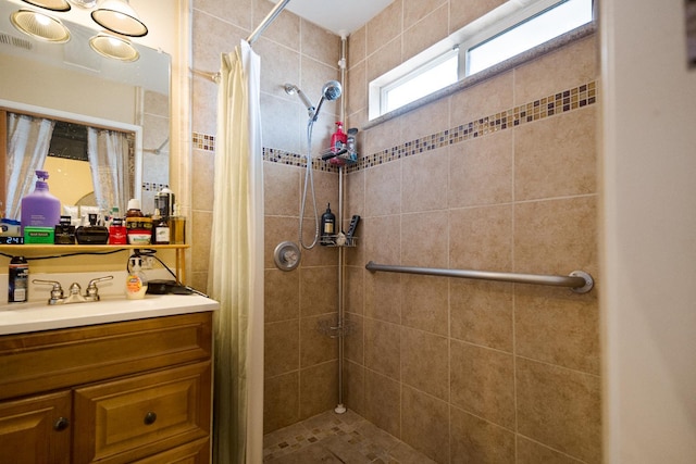 51 E Tuolumne St, Fresno, CA 93706 - bathroom with a tile shower and vanity
