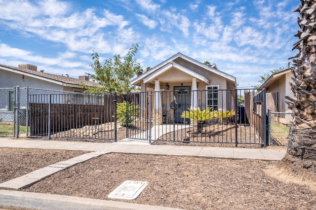 51 E Tuolumne St, Fresno, CA 93706 - view of front of home featuring a gate, a fenced front yard, and stucco siding