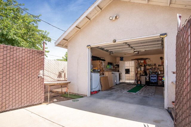 51 E Tuolumne St, Fresno, CA 93706 - garage featuring driveway and separate washer and dryer