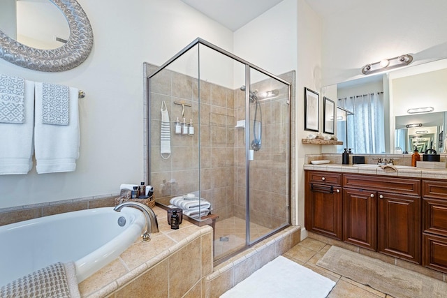 2639 Maine Ave, Clovis, CA 93619 - bathroom featuring a bath, a stall shower, vanity, and tile patterned floors
