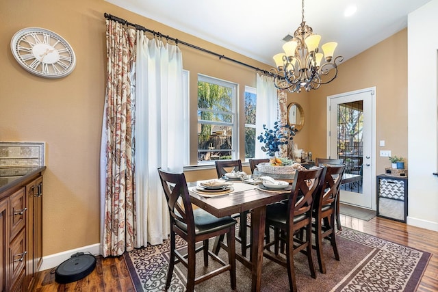 2639 Maine Ave, Clovis, CA 93619 - dining room with a chandelier and dark wood-style floors
