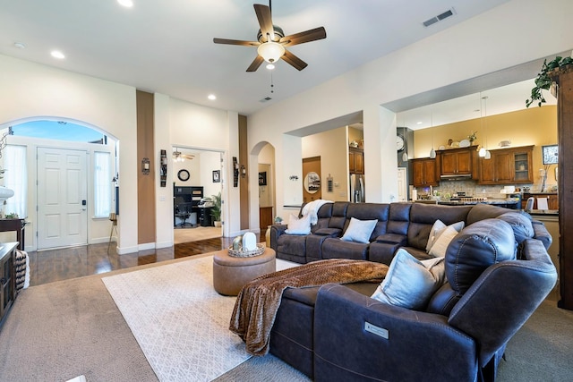 2639 Maine Ave, Clovis, CA 93619 - living area with ceiling fan, arched walkways, recessed lighting, and dark wood-style floors