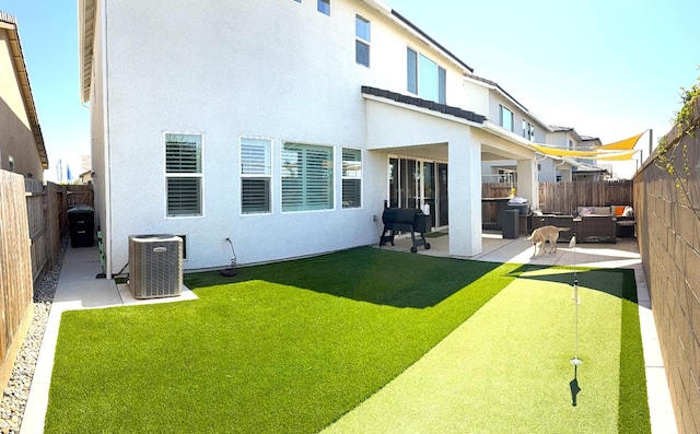 971 Dana Rd W, Madera, CA 93636 - rear view of house featuring a putting area, an outdoor hangout area, a patio area, and a fenced backyard
