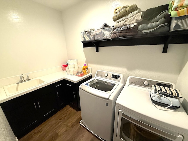 971 Dana Rd W, Madera, CA 93636 - laundry area with separate washer and dryer, dark wood-style flooring, and cabinet space