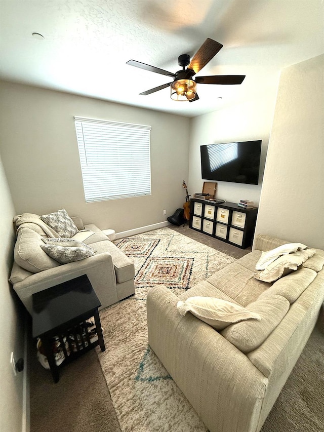 971 Dana Rd W, Madera, CA 93636 - carpeted living area featuring a ceiling fan and baseboards