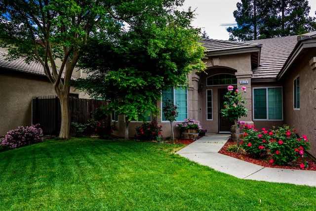 9930 N Rowell Ave, Fresno, CA 93720 - view of exterior entry with stucco siding and a tile roof