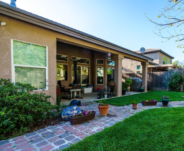9930 N Rowell Ave, Fresno, CA 93720 - rear view of property with a patio and stucco siding