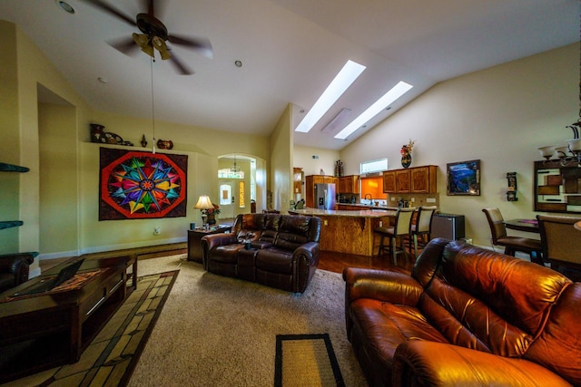 9930 N Rowell Ave, Fresno, CA 93720 - living area with arched walkways, ceiling fan, high vaulted ceiling, and a skylight