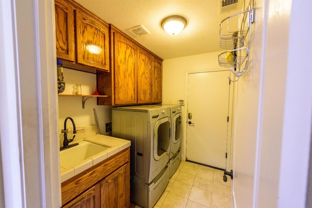 9930 N Rowell Ave, Fresno, CA 93720 - washroom featuring cabinet space and washer and clothes dryer