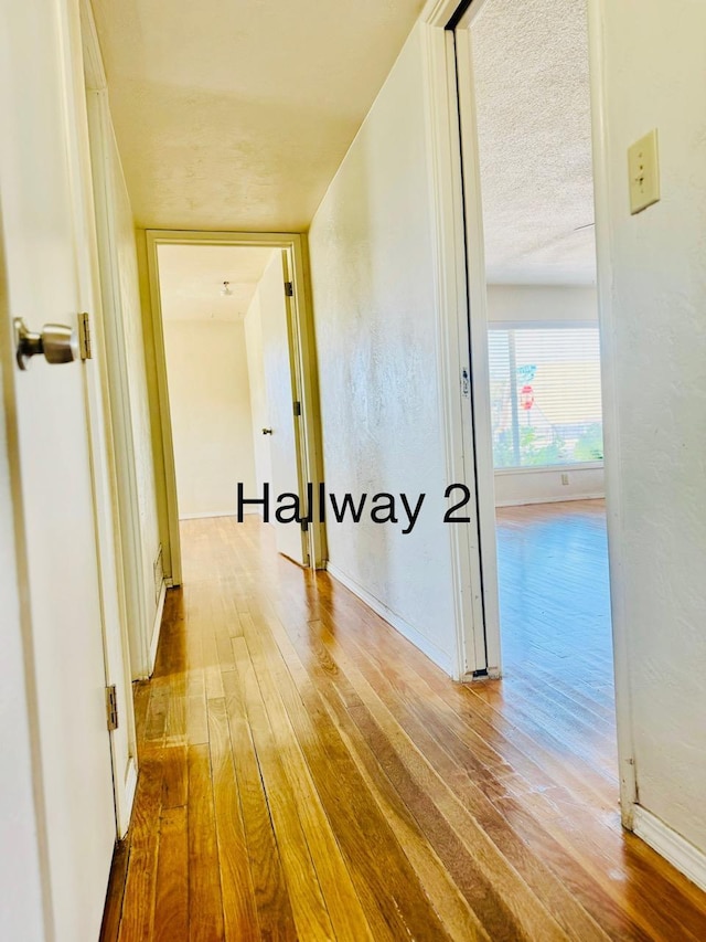 3646 E Dayton Ave, Fresno, CA 93726 - hallway featuring wood-type flooring