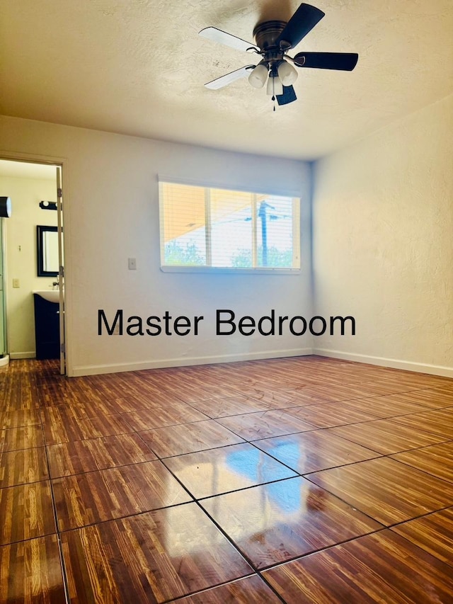 3646 E Dayton Ave, Fresno, CA 93726 - empty room featuring wood finished floors, ceiling fan, and a textured ceiling