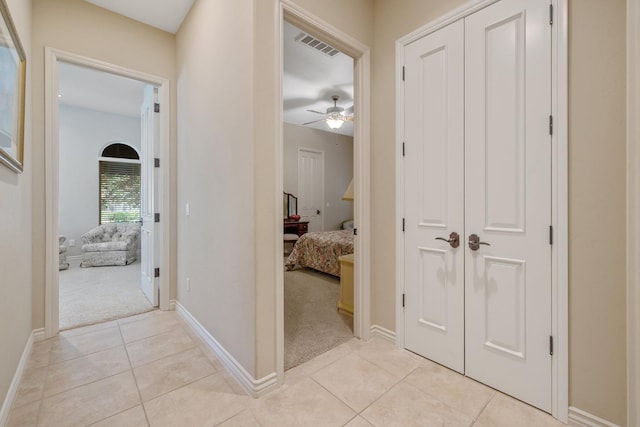 4638 W Lark Ct, Visalia, CA 93291 - hallway featuring light colored carpet and light tile patterned floors
