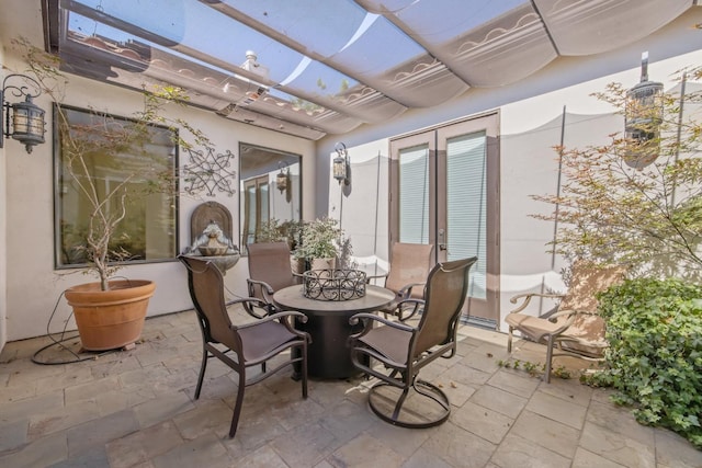 4638 W Lark Ct, Visalia, CA 93291 - view of patio / terrace featuring a pergola, outdoor dining area, and french doors