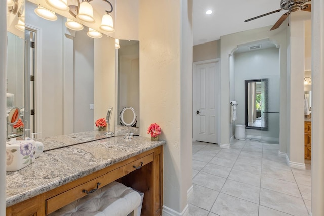 4638 W Lark Ct, Visalia, CA 93291 - bathroom featuring tile patterned floors, ceiling fan, and vanity
