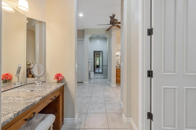 4638 W Lark Ct, Visalia, CA 93291 - bathroom with tile patterned floors, vanity, and ceiling fan