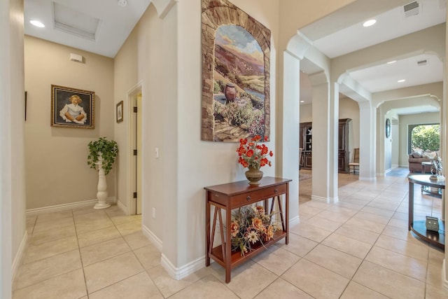 4638 W Lark Ct, Visalia, CA 93291 - hallway featuring arched walkways, light tile patterned flooring, and recessed lighting