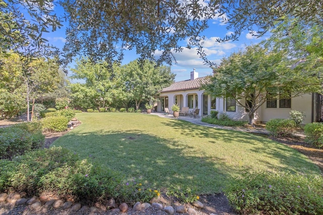 4638 W Lark Ct, Visalia, CA 93291 - view of green lawn with a patio