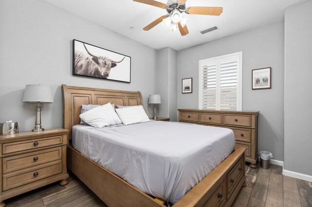 5313 W King Fisher Ln, Fresno, CA 93722 - bedroom featuring dark wood-style flooring and a ceiling fan