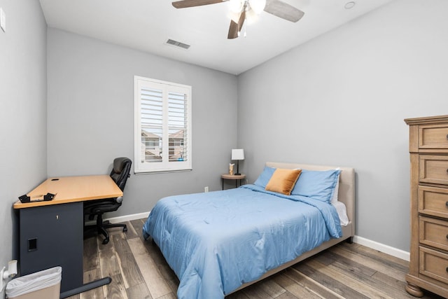 5313 W King Fisher Ln, Fresno, CA 93722 - bedroom with a desk, wood finished floors, and ceiling fan