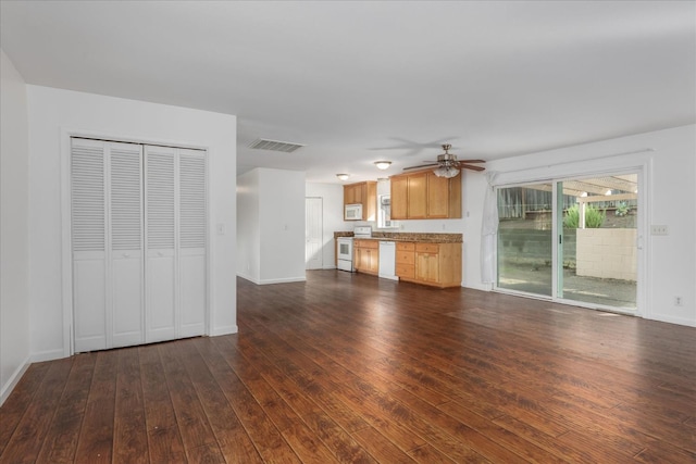 40885 Elliott Dr, Oakhurst, CA 93644 - unfurnished living room featuring dark wood-style floors and a ceiling fan