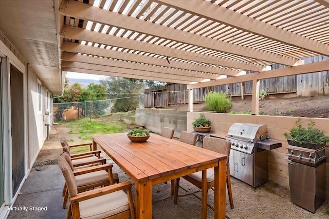 40885 Elliott Dr, Oakhurst, CA 93644 - fenced backyard with outdoor dining area, area for grilling, and a pergola