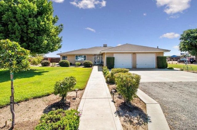 12420 S Chestnut Ave, Fresno, CA 93725 - ranch-style house featuring driveway, a garage, a front yard, and stucco siding