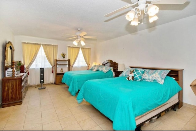 12420 S Chestnut Ave, Fresno, CA 93725 - bedroom with tile patterned flooring and a ceiling fan