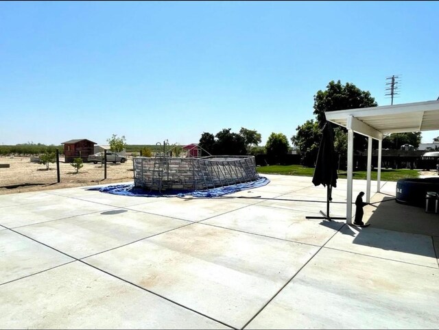 12420 S Chestnut Ave, Fresno, CA 93725 - view of patio / terrace featuring a pool