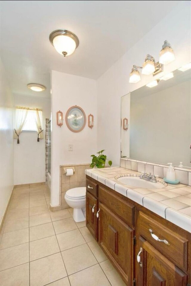 12420 S Chestnut Ave, Fresno, CA 93725 - full bathroom featuring tile patterned floors, vanity, and a shower with shower door