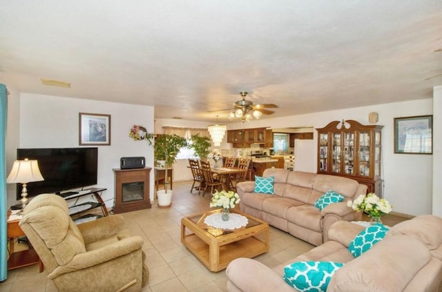 12420 S Chestnut Ave, Fresno, CA 93725 - living room with light tile patterned flooring and a ceiling fan
