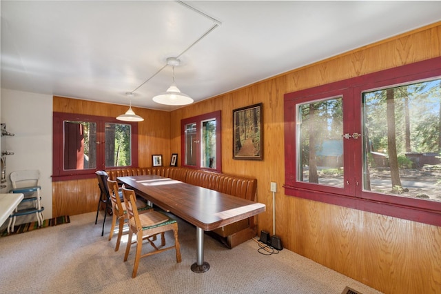 83634 Presidents Ln, Wilsonia, CA 93633 - carpeted dining area with plenty of natural light, wood walls, and french doors