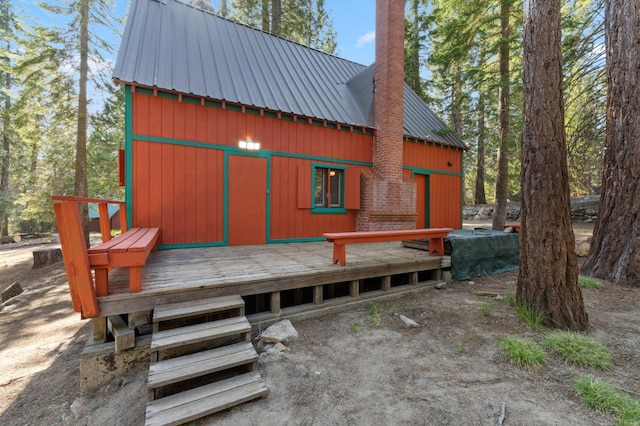 83634 Presidents Ln, Wilsonia, CA 93633 - rear view of house featuring a metal roof, a chimney, and a deck