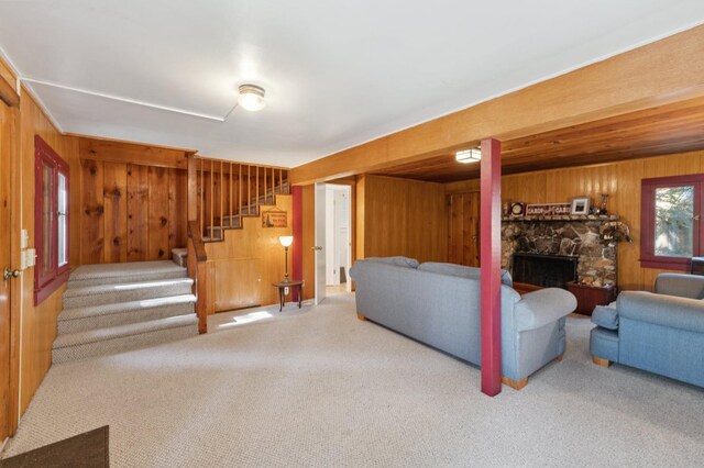 83634 Presidents Ln, Wilsonia, CA 93633 - carpeted living area with wood walls, stairway, and a fireplace