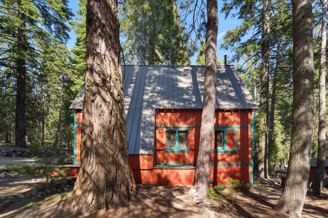 83634 Presidents Ln, Wilsonia, CA 93633 - rustic home with a metal roof and an outbuilding