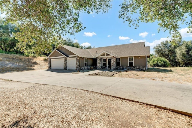 46453 Opah Dr, Ahwahnee, CA 93601 - single story home with stone siding, a garage, and driveway