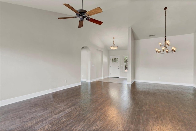 46453 Opah Dr, Ahwahnee, CA 93601 - unfurnished living room featuring arched walkways, dark wood-type flooring, a ceiling fan, a chandelier, and high vaulted ceiling