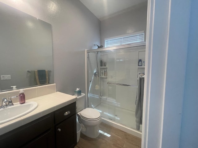 803 E Aretha Ave, Fowler, CA 93625 - bathroom featuring a stall shower, vanity, wood finished floors, and lofted ceiling