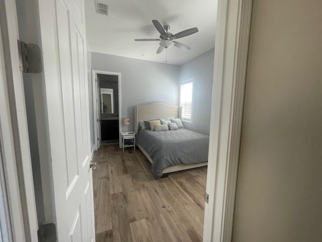 803 E Aretha Ave, Fowler, CA 93625 - bedroom with light wood finished floors and a ceiling fan