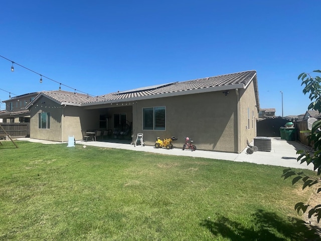 803 E Aretha Ave, Fowler, CA 93625 - back of house featuring stucco siding, a patio area, and a tile roof