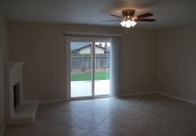 1139 W Alluvial Ave, Fresno, CA 93711 - unfurnished living room featuring a ceiling fan, a fireplace, and tile patterned flooring