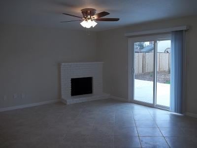 1139 W Alluvial Ave, Fresno, CA 93711 - unfurnished living room featuring a ceiling fan, a brick fireplace, and tile patterned floors