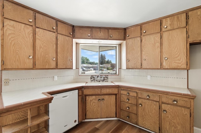 4558 E Weldon Ave, Fresno, CA 93703 - kitchen with white dishwasher, decorative backsplash, dark wood-style floors, and tile countertops