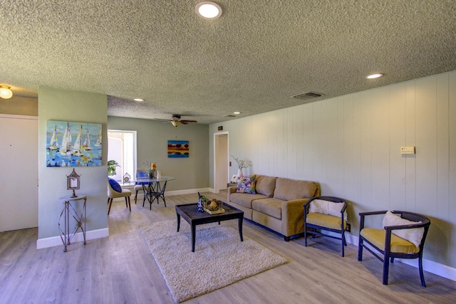 3364 E Princeton Ave, Fresno, CA 93703 - living room featuring a textured ceiling, wood finished floors, a ceiling fan, and recessed lighting