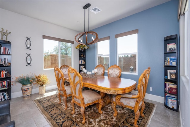 602 Pinnacle Dr W, Madera, CA 93636 - dining space with a chandelier and baseboards
