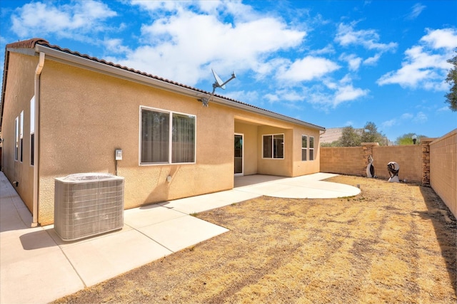 602 Pinnacle Dr W, Madera, CA 93636 - back of house featuring stucco siding, a fenced backyard, and a patio