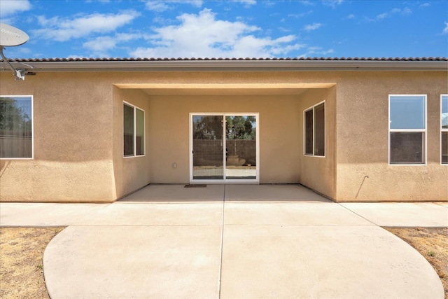 602 Pinnacle Dr W, Madera, CA 93636 - rear view of house featuring stucco siding and a patio area