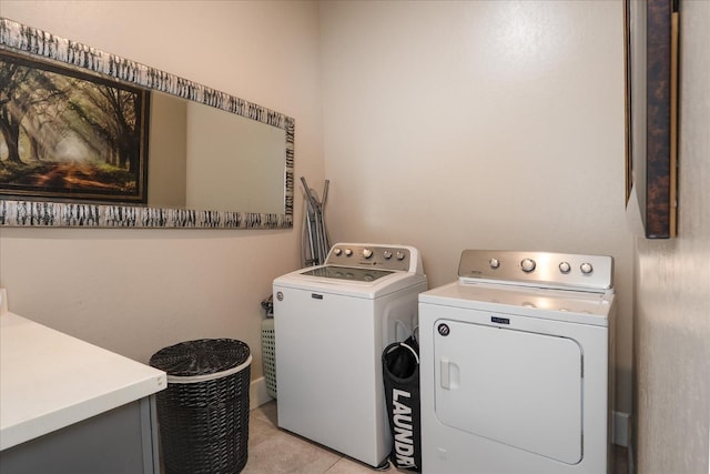 602 Pinnacle Dr W, Madera, CA 93636 - laundry area with washer and dryer and light tile patterned floors