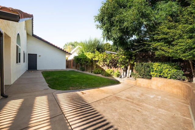 318 San Madele Ave, Coalinga, CA 93210 - fenced backyard featuring a patio area
